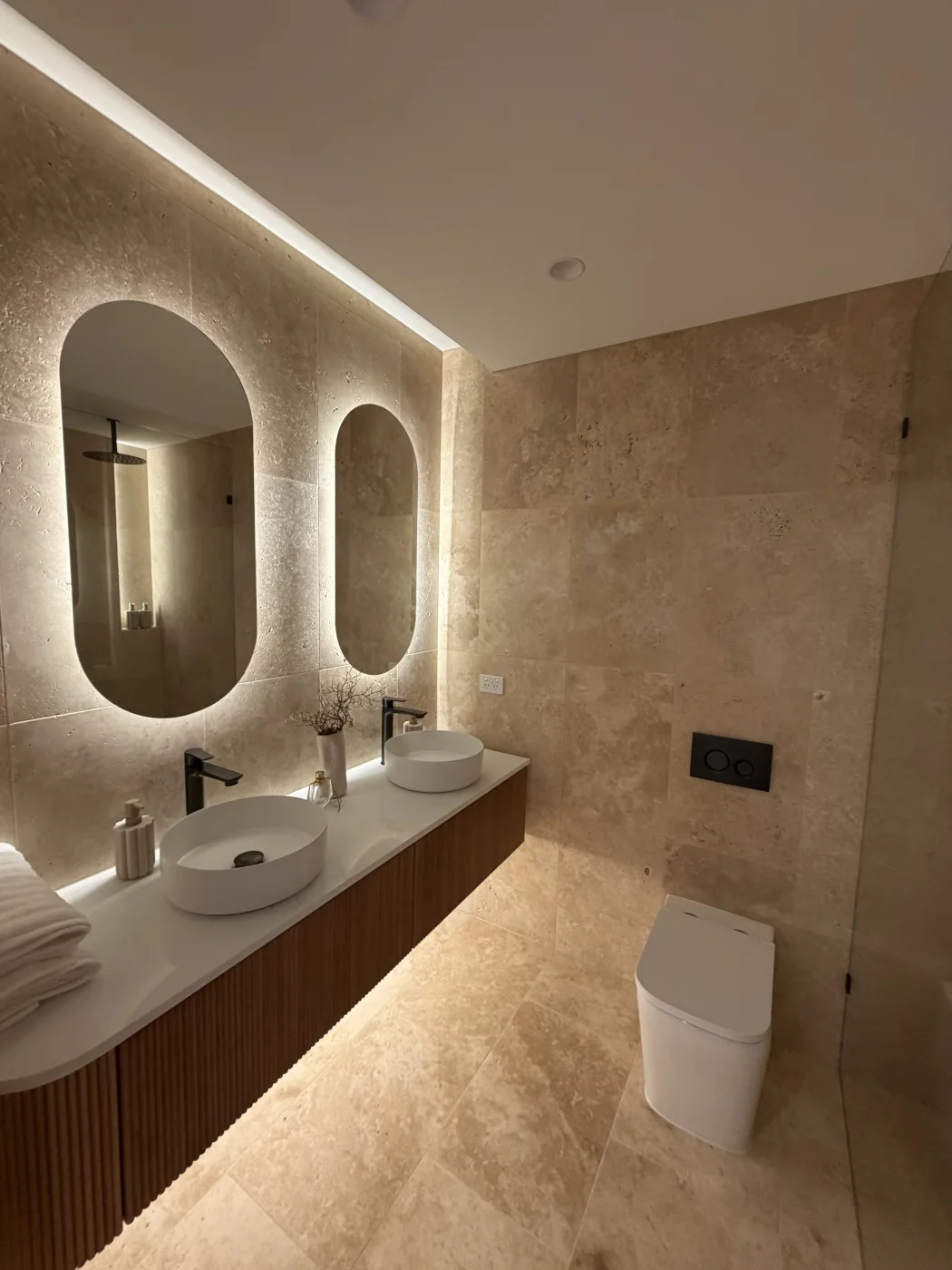 Backlit bathroom mirrors and concealed lighting installation