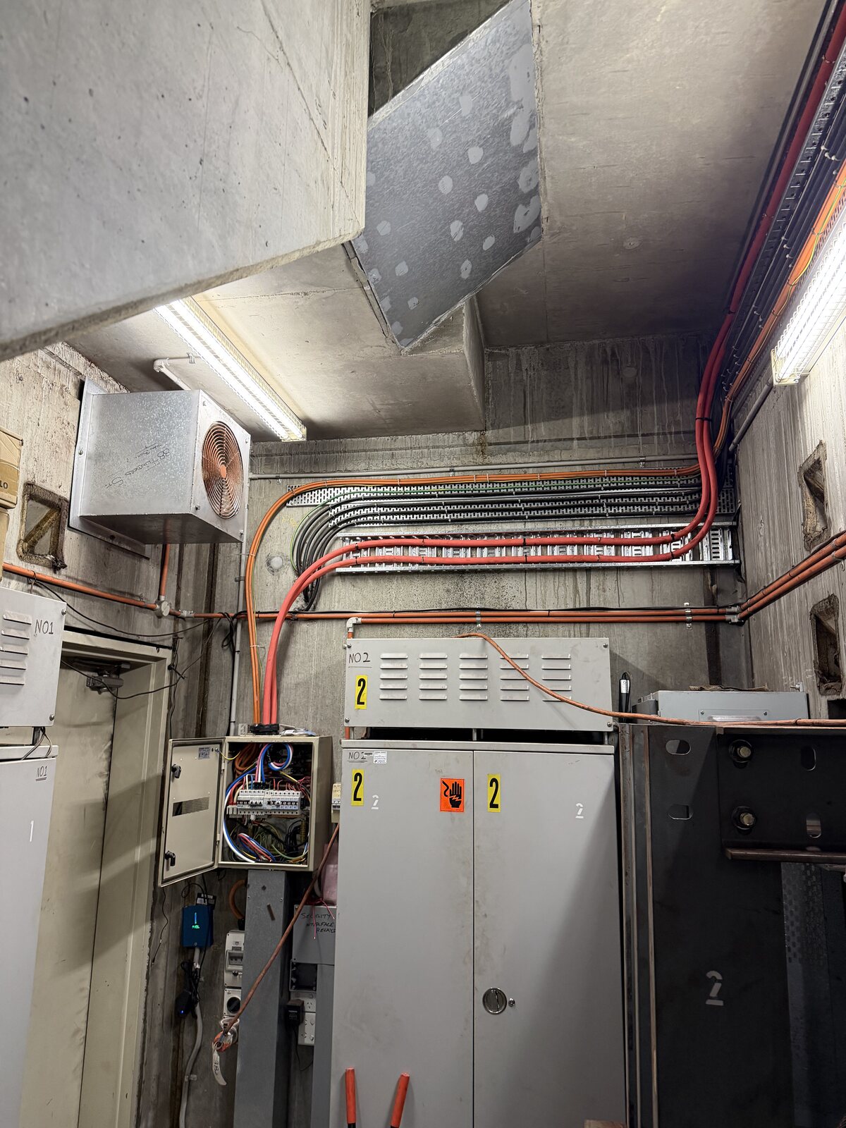 Electrical cabinets and organised cable runs in a commercial plant room